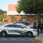 The now familiar sight of stepped-up police presence whenever social media chatter alludes to a threat at a local school. The scene above dates back to one such threat at FPC two years ago. (© FlaglerLive)