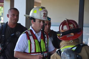 Flagler Beach Fire Department Captain Steve Cox at this morning's fire at Flagler Plaza. (© FlaglerLive)