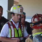 Flagler Beach Fire Department Capt. Steve Cox, center. (© FlaglerLive)