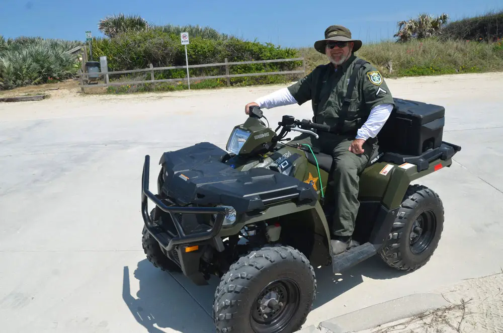 Steve Williams, a veteran Flagler County Sheriff's deputy, on his ATV during a beach-patrol assignment. (© FlaglerLive)