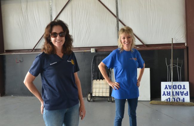 The Flagler Beach Rotary's Roseanne Stocker, in the foreground, and Cindy Dalecki, driving forces in an organization of barely more than 40 members that seems to be doing the job of thousands. Stocker started Project Warm 18 years ago, when, as she put it, 'it was my dad and me in our cars.” Click on the image for larger view. (© FlaglerLive)