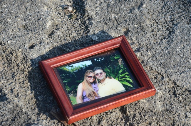 A portrait apparently recovered from the car, placed on the rock revetment. (c FlaglerLive)