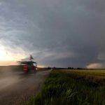 Scientists in a truck outfitted with instruments race toward a storm. National Severe