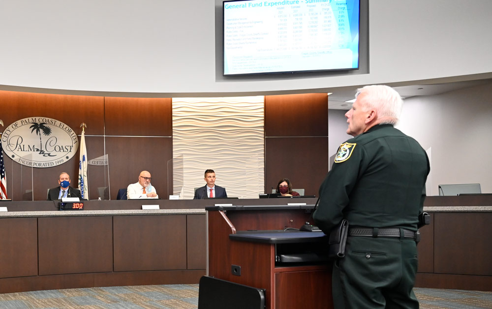 It's familiar grounds for Chief Mark Strobridge, seen here addressing the City Council on budgetary issues in a 2021 meeting. He was not at Tuesday's meeting. (© FlaglerLive)