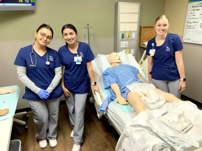 * From left, UNF nursing students Dounya Alamad, Mia Scarcella and Kylee McCurdy are training at the Regional Simulation Center at AdventHealth Palm Coast. (© FlaglerLive)