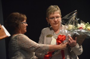 Sue McVeigh accepting the honors from Superintendent Janet Valentine. Click on the image for larger view. (© FlaglerLive)