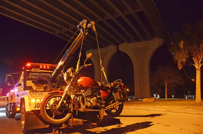 The man had ridden an unmarked motorcycle, a Suziki, to the middle of the bridge before jumping off. Click on the image for larger view. (© FlaglerLive)