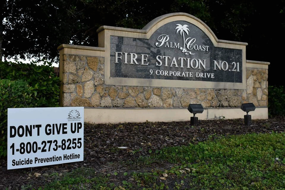 The suicide prevention signs had appeared for a few days at Palm Coast fire stations, then were taken down over right of way concerns. (© FlaglerLive)