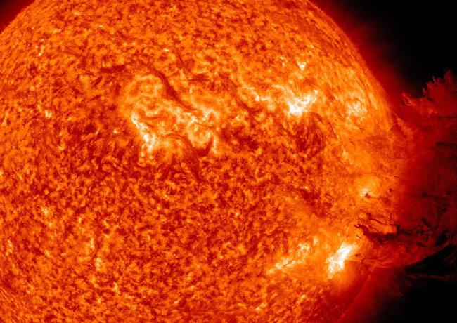 When the sun gets angry. The sun here unleashes a medium sized solar flare as rotation carried active regions of sunpots toward the solar limb, in an image captured in 2011 by the Solar Dynamics Observatory. (NASA / Goddard / SDO AIA Team)