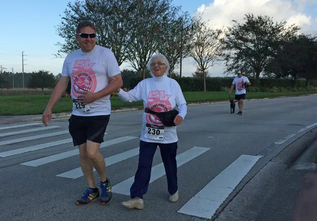 Mim Lique, 81, right, was the oldest competitor in Sunday's Pink Artmy 5K Run and Walk in Town Center, to benefit breast-cancer awareness and research, and she won her division. (© FlaglerLive)