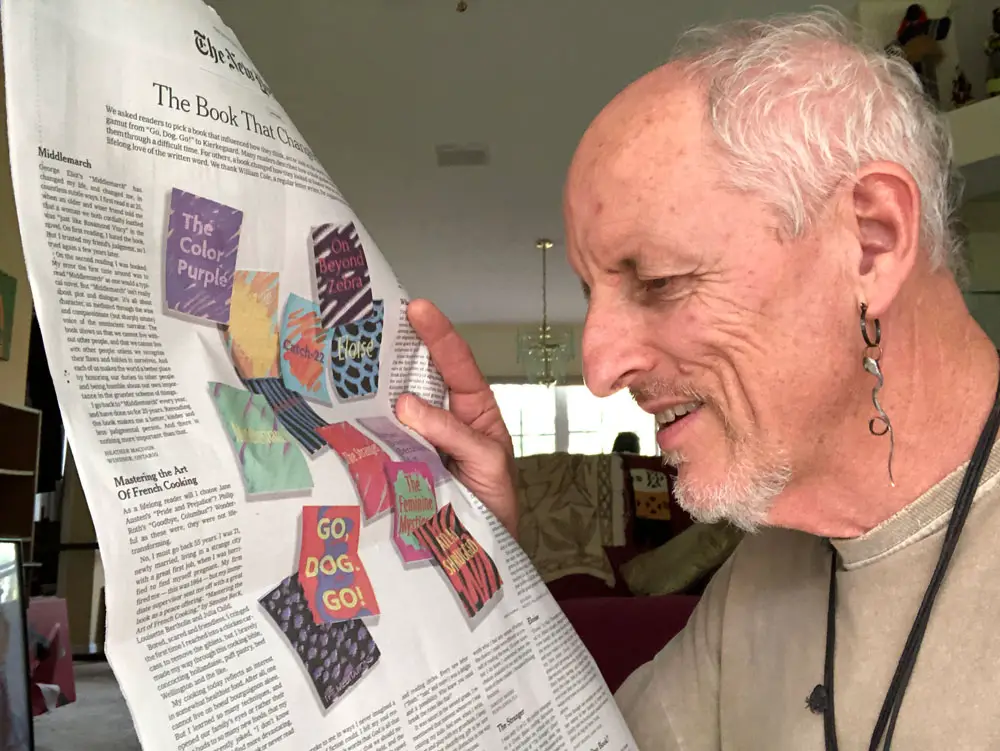 Rick de Yampert with a copy of The New York Times opened to the Sunday Review page with his mini-essay on the book that changed his life. (© FlaglerLive)