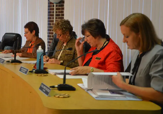 The Flagler Beach City Commission's Jane Mealy (left), Kim Carney (third from left)_ and Mayor Linda Provencher, foreground, attended a closed-door county staff meeting with the U.S. Corps of Engineers last week, raising questions of sunshine violations. Joy McGrew, second from left, was not involved. (© FlaglerLive)