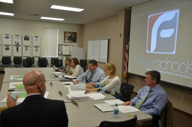 The Flagler County School Board's dynamics have changed markedly since Trevor Tucker, right, became its chairman, coinciding with the board's search for a replacement for Superintendent Jacob Oliva, in the foreground. Oliva is taking a job at the state Department of Education. (c FlaglerLive)