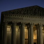 The U.S. Supreme Court building at dawn in Washington, D.C.