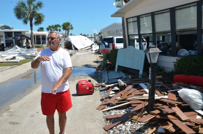 'The waters came up a foot and a half this year,' Rich Morey says outside his home, which he plans on replacing entire. Click on the image for larger view. (c FlaglerLive)