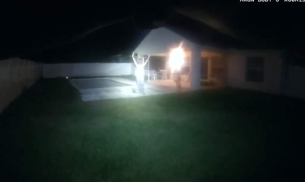 Sheriff's deputies arrested a 19-year-old an in palm Coast's E-Section after the man had gone on a rampage at his home, then banged with a shovel on the glass door at another home. (© FlaglerLive via bodycam video)