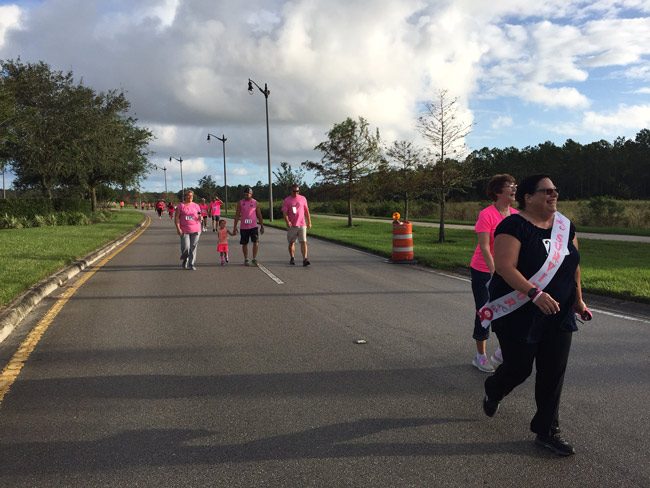 A survivor among the thousand-off walkers and runners in Sunday's Pink Army Run from Florida Hospital Flagler, through Town Center and back. (© FlaglerLive)