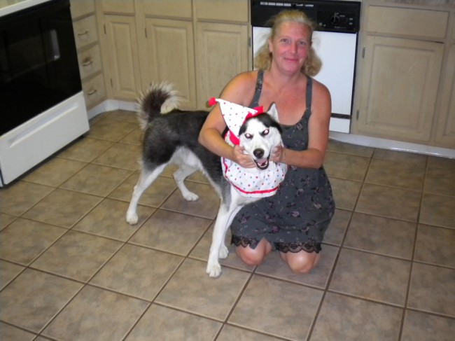 Susan Jones at home with one of her four dogs. Click on the image for larger view. (Courtesy of Susan Jones)