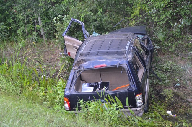 The SUV after it was righted, but still in the ditch. Click on the image for larger view. (© FlaglerLive)