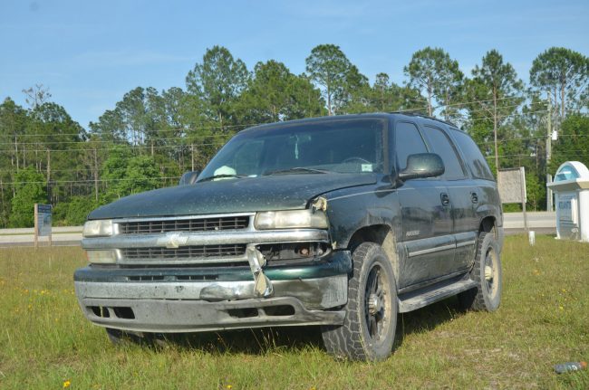 Tyler Anderson's SUV after the crash, showing minor damage to its front left. (© FlaglerLive)