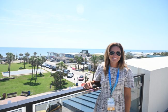 Former Mayor Suzie Johnston had been at the groundbreaking 15 months ago, and was at the ribbon-cutting today, taking in the view from the hotel's rooftop bar over the pier and the rest of the city. (© FlaglerLive)