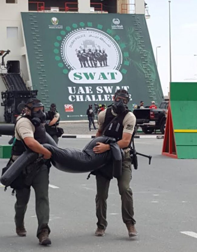 Sgt. Mike Breckwoldt and Sgt. Ryan Emery carry the equivalent of a human body during competition. One of the challenges was a timed officer rescue. (FCSO)