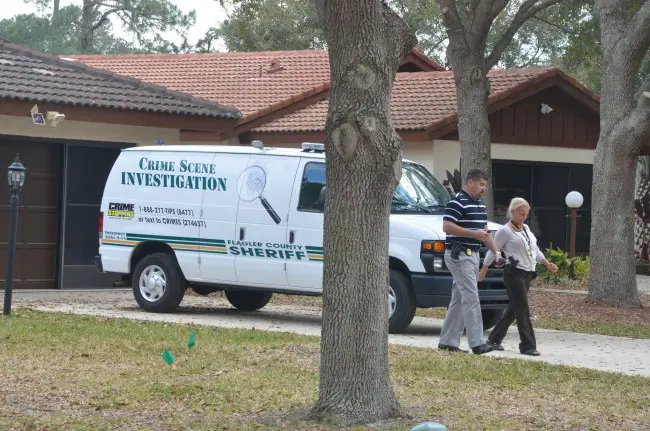 A small SWAT team and detectives served a warrant at 31 Lago Vista Place, where a man at the center of a controversy over a little after 3 p.m. today. (c FlaglerLive)