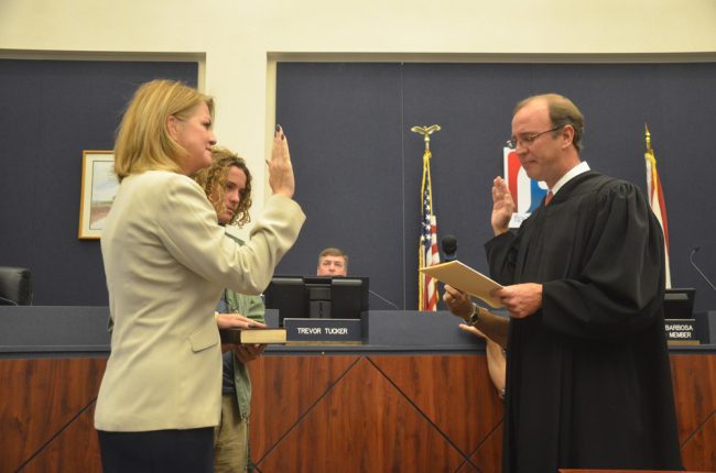 The swearing-in by Circuit Judge R. Lee Smith after Conklin's 2016 re-election. (© FlaglerLive)