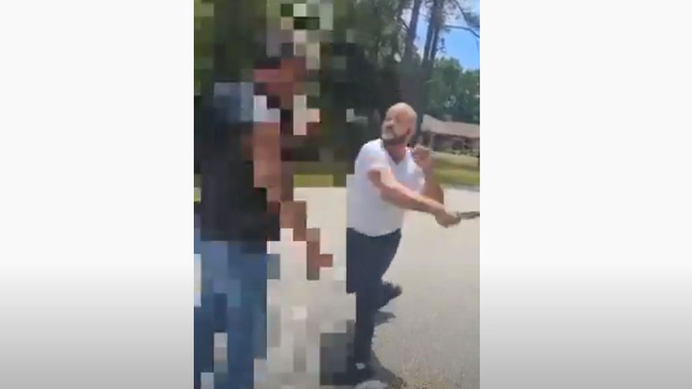 Rafael Vincent Rivera seen swinging with a knife at a man following a road rage incident Tuesday in Palm Coast. (© FlaglerLive via YouTube)