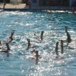 The Synchro Belles, the synchronized swimming team, has used the Belle Terre Swim and Racquet Club for years. That won't change. But a majority of Flagler County School Board members are eager to close the swim club to the public. (© FlaglerLive)
