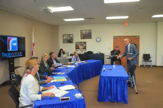 The next stop for James Tager, right, is to negotiate his contract. He starts work for the Flagler County School Board on June 1. (© FlaglerLive)