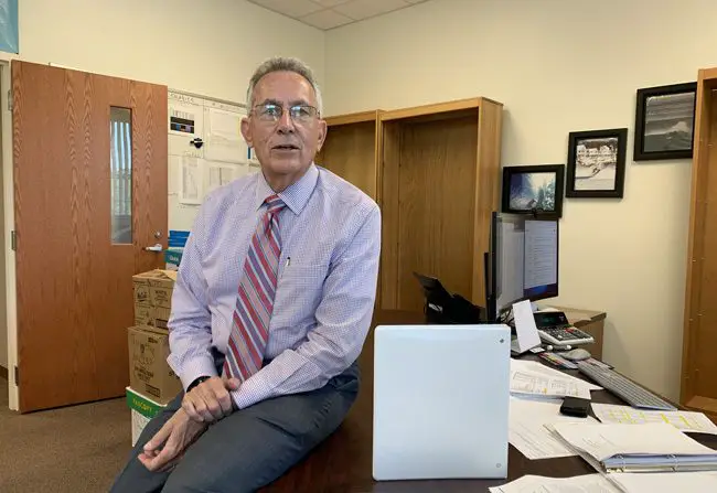 Tom Tant, the Flagler school district's finance chief, is eager to explain why the state's allegations of an education funding increase for Flagler aren't nearly what they seem. His office's shelves were bare because he was temporarily moving to a different floor for renovations. (c FlaglerLive)