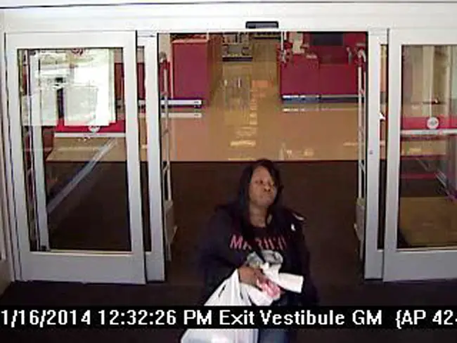 The suspect is seen exiting Target Thursday, allegedly after buying goods with a stolen credit card. 