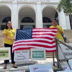 Opponents of a new state law restricting land ownership by people from China gathered Tuesday outside the federal courthouse in Tallahassee. (Tom Urban/NSF)