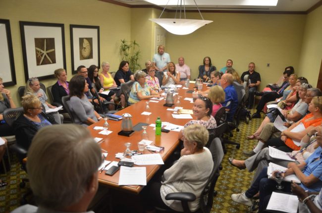 Monday's opioid 'task force' meeting drew some 45 people crowded into a room with a posted capacity of 20. (© FlaglerLive)