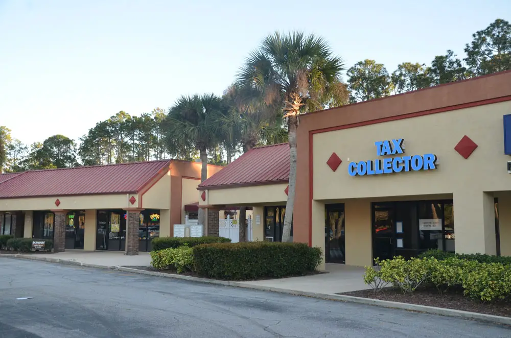 The new Tax Collector's branch location in Palm Coast will open at St. Joe Plaza, immediately adjacent to the Brown Dog pub. (© FlaglerLive)