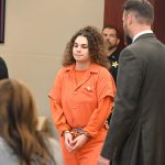 Taylor Manjarres, 20, walking to the lectern to hear her sentence this afternoon. Her plea deal reduced her exposure from life in prison to 12 years. (© FlaglerLive)