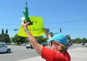 Honk for tea parties: a scene from history on Palm Coast Parkway, circa 2012. (© FlaglerLive)