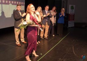 Donell Evensen, the Teacher of the Year, acknowledged by the five Flagler County School Board members and the audience at the Flagler Auditorium. Click on the image for larger view. (Flagler Schools)