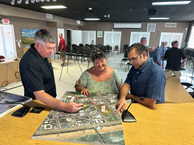  From left, General Contractor Jeremy Bain of Maitland-based Welbro Building Corp</a>, Flagler Beach's Caryn Miller, director of downtown redevelopment (known as the Community Redevelopment Agency) and Manoj Bhoola, the developer and manager of Ormond Beach-based Elite Hospitality. (© FlaglerLive)