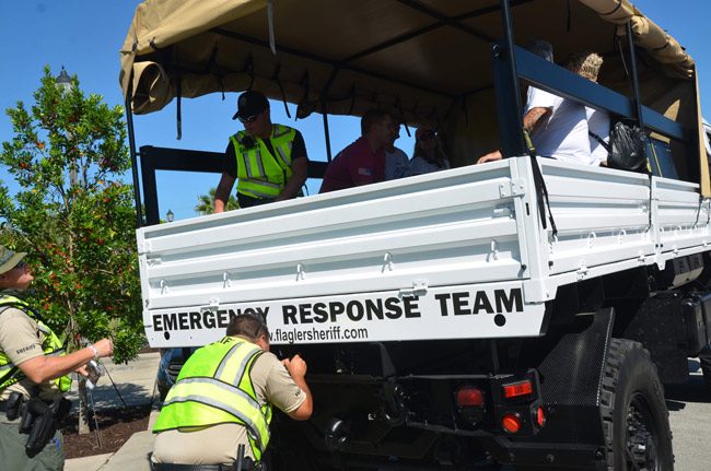 A team of volunteers prepares to head out for the search for Ricky Wheeler this afternoon, setting out from Central Avenue in Town Center under sheriff's office guidance. (© FlaglerLive)