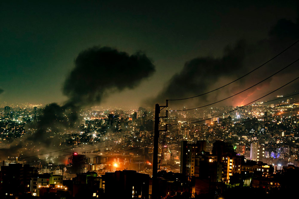 Smoke rises from locations targeted in Tehran amid the third day of Israel’s waves of strikes against Iran, on June 15, 2025.