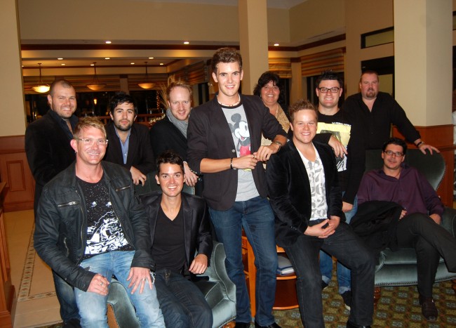 Ten tenors and a soprano: Auditorium Director Lisa McDevitt, behind Jordan Pollard (in the Mickey Mouse shirt), canceled Tuesday's show for her boys' protection. The Hilton substituted for their stage tonight. Click on the image for larger view. (© FlaglerLive)