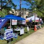 Competing tents at the Flagler County Public Library, one of three early voting sites. (© FlaglerLive)