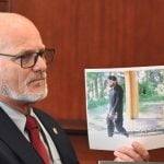 Testifying today in Antonio Figueroa-Acevedo's bond hearing, Bunnell Police Detective Jeff Traylor identified Figueroa-Acevedo, dressed in black and with a Covid mask below his mouth, as he was leaving the apartment building where he allegedly attacked and raped his ex-girlfriend on June 12. (© FlaglerLive)