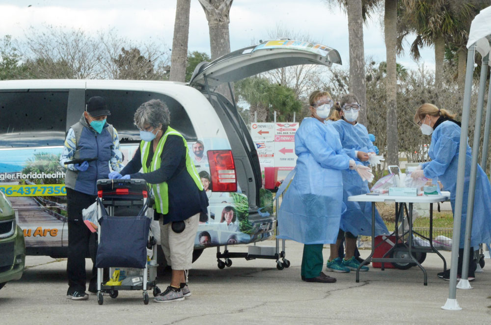 A day of grim Covid records in Flagler County and the country as a local hospital is in ‘red status’ and vaccines are drying up