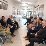 It was a cattle call: the candidates waiting for their auditions before the Palm Coast City Council. They'd been made to sit and wait in the hallway. The snack room, the usual green room for applicants in previous rounds, was not available. (© FlaglerLive)