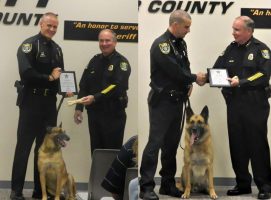 Deputy Robert Tarczewski with K-9 Deputy Repo and Deputy Joe Dailey with K-9 Deputy Reno receiving certificates from Sheriff Rick Staly last week. (FCSO)