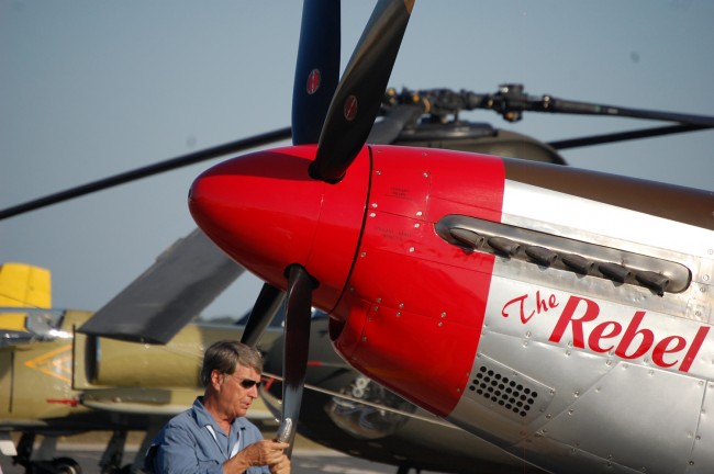 Pilot Doug Matthews of West Palm Beach in front of his vintage 1944 P-51 Mustang. (© FlaglerLive)