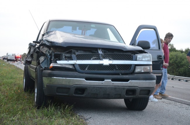 The third vehicle involved in the wreck, and its survivors. Click on the image for larger view. (© FlaglerLive)